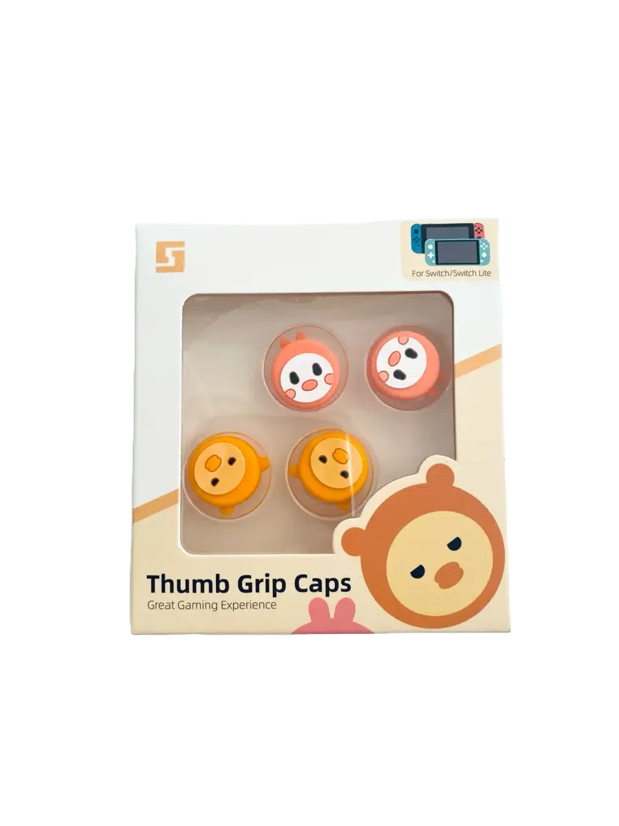 A product box containing four circular thumb grip caps for a Nintendo Switch. Two caps are orange and two are yellow, each featuring a cute, white "kawaii" animal face with pink cheeks. The packaging is white with the text "Thumb Grip Caps" and "Great Gaming Experience."