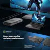 GPD WIN Mini 2024 collegato a GPU esterna (eGPU) e monitor grande. Il dispositivo compatto a conchiglia mostra un personaggio corazzato futuristico sul suo schermo da 7". L'unità eGPU migliora le prestazioni grafiche. Il monitor grande mostra una vista di gioco espansa. Il setup dimostra versatilità - dal gaming portatile alle prestazioni da desktop. Il testo evidenzia "Potenzia le tue prestazioni di gioco e lavoro con un'eGPU". Presenta porte USB 4 con velocità di 40Gbps, compatibili con accessori e docking station. Nota: GPD G1 eGPU venduta separatamente.