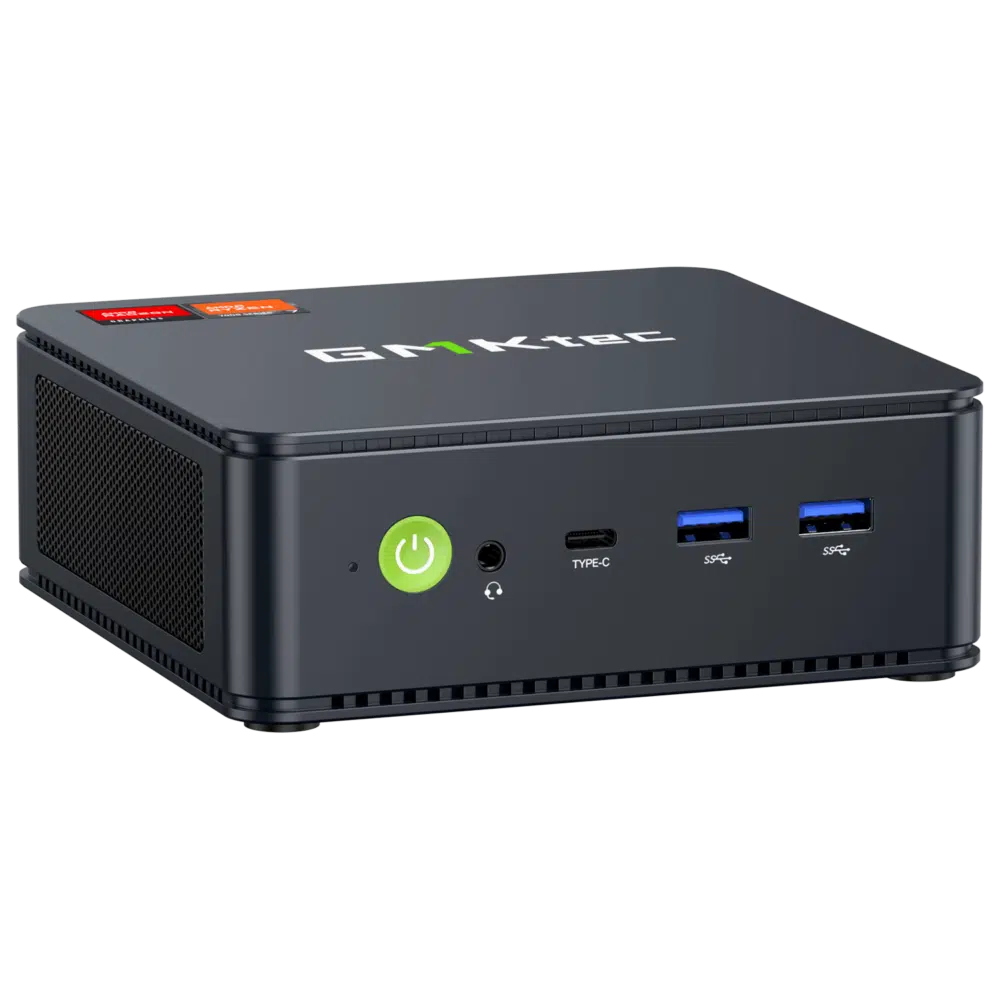 L'immagine mostra il Mini PC GMKTEC NUBOX M5, un dispositivo di calcolo elegante e compatto. Ha un design moderno con una finitura nera opaca. Il pannello frontale presenta diverse porte di connettività, incluse porte USB e un jack audio, e il logo GMKTEC è ben visibile sulla parte superiore. Il design complessivo è minimalista, enfatizzando la portabilità e la funzionalità per diverse attività di calcolo.