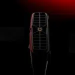 Rear exhaust port of the AYANEO AG01 Graphics Dock with a central screw mount, set against a dramatic red and black background.
