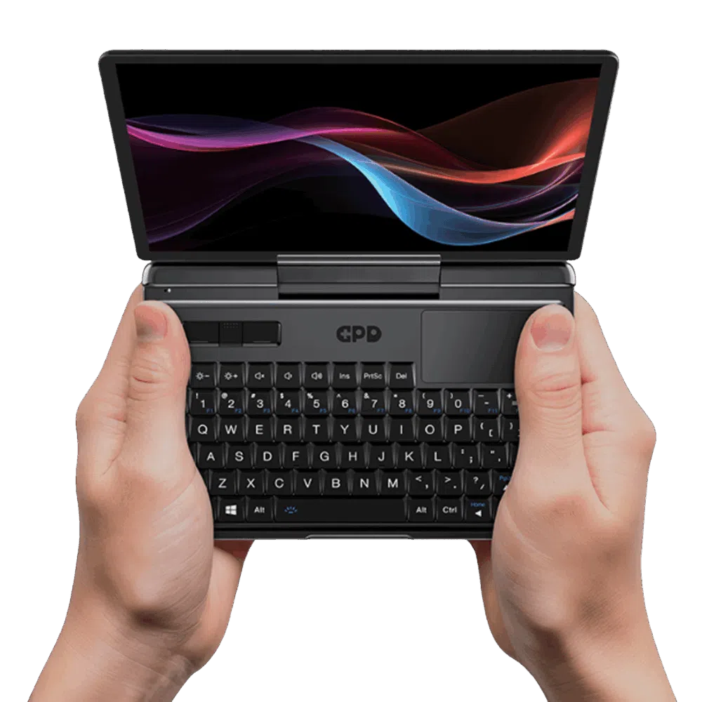 The GPD MicroPC 2 being held in both hands, showcasing its compact 7-inch touchscreen, rugged industrial design, and thumb-typing-friendly keyboard for IT professionals and field engineers