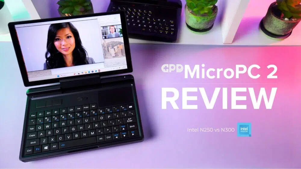 Dünaamiline pisipilt GPD MicroPC 2 ülevaatevideo jaoks. Must GPD MicroPC 2 on esiplaanil, avatud ja vaataja poole kaldu ning selle ekraanil kuvatakse videokonverentsi kõnet, millel on naise nägu. Näha on sülearvuti kompaktne klaviatuur ja puuteplaat. Taustal on valge riiul, millel on potitaimed ja veel üks GPD MicroPC 2. Sülearvuti all olev laud on elava roosa ja lilla gradientiga. Sülearvuti paremal pool on suur valge tekst "GPD MicroPC 2 REVIEW" ja selle all väiksem tekst "Intel N250 vs N300" koos "Intel inside" logoga.