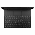 A top-down view of the black GPD WIN MAX 2 handheld gaming PC with its screen flipped back, revealing the full QWERTY keyboard and central touchpad. The game controller elements are hidden beneath covers on either side of the touchpad.