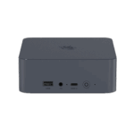 A straight-on front view of a dark grey, square-shaped mini PC with rounded corners, set against a solid dark green background. The top surface has a subtle textured pattern and a circular logo. The front panel features a USB-A port, a headphone jack, a USB-C port, and a power button with a circular LED indicator. All ports and buttons are labeled with white text.