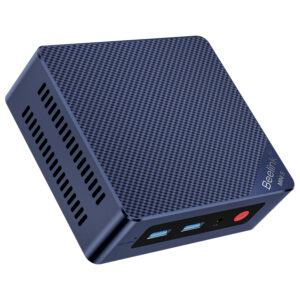 An overhead, angled shot of the dark blue Beelink Mini S12 mini PC against a plain grey background. The top surface features a textured, carbon fiber-like pattern. The front panel, visible on the left, shows a "CLR CMOS" pinhole, two USB-A ports, and a red power button. The "Beelink MINI S" logo is visible on the right side.