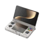 An angled, open view of a light grey AYN Thor handheld gaming console with a clamshell design, against a dark, featureless background. The top screen is open, displaying a soft golden abstract image. The bottom half of the device shows the controls, including a black D-pad, black analog sticks, and face buttons in red, blue, green, and yellow, resembling the classic "rainbow" controller aesthetic. Both the top and bottom screens are reflective, mirroring the golden light.