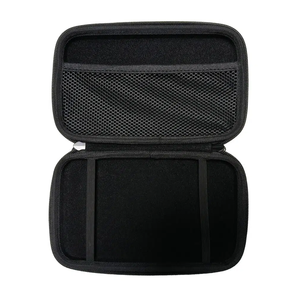 A top-down shot of the black hard shell case for the GPD MicroPC 2, opened to reveal its interior. The top half of the case has a mesh pocket, while the bottom half is empty with two elastic straps meant to hold the device.