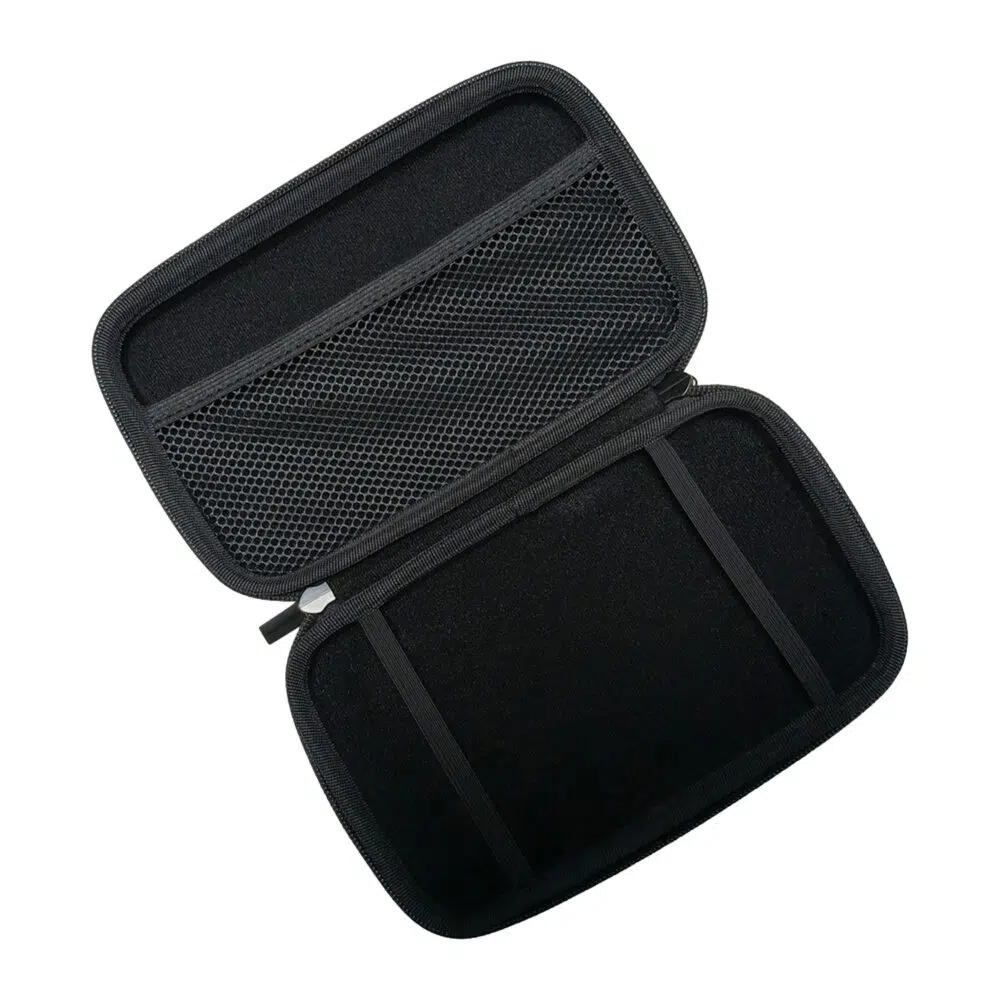 A top-down, angled shot of the black hard shell case for the GPD MicroPC 2, opened to reveal its interior. The top half of the case has a mesh pocket for accessories, while the bottom half has two elastic straps to securely hold the device. The case is empty.