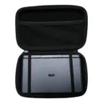 A top-down shot of the open, black hard shell case for the GPD MicroPC 2. A grey GPD MicroPC 2 is secured inside the bottom half with two black elastic straps. The top half of the case has a mesh pocket. The front of the MicroPC 2 is facing upwards, showing the "GPD" logo.