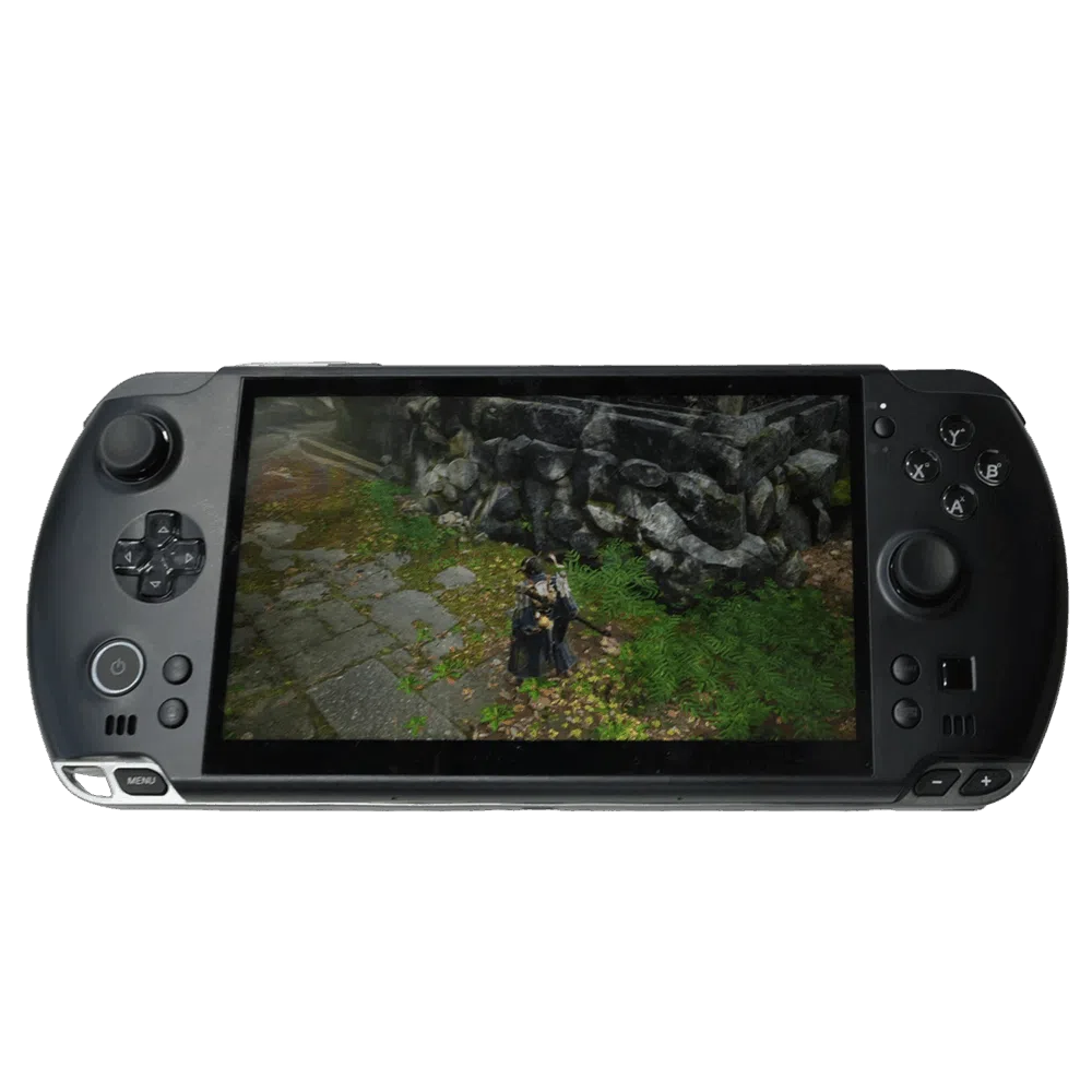 A GPD WIN 5 handheld gaming console in a dark grey color is centered against a plain grey background. The console's large widescreen display shows a third-person video game with a character standing on a stone path next to a wall. The console features a D-pad and analog stick on the left, and face buttons (A, B, X, Y) and a second analog stick on the right. Additional buttons like a menu button and start/select buttons are also visible.