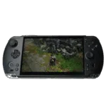 A GPD WIN 5 handheld gaming console in a dark grey color is centered against a plain grey background. The console's large widescreen display shows a third-person video game with a character standing on a stone path next to a wall. The console features a D-pad and analog stick on the left, and face buttons (A, B, X, Y) and a second analog stick on the right. Additional buttons like a menu button and start/select buttons are also visible.