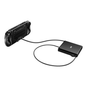 An angled shot of the GPD WIN 5 handheld gaming console from behind, against a white background. The device is connected via a black cable to a flat, rectangular black dock or power bank. This view highlights the device's back with its grips, vents, and a sticker with product information.