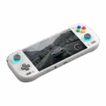  An angled shot of a white AYN Odin3 handheld gaming console against a dark green background. The console features a D-pad and analog stick on the left and face buttons with an analog stick on the right. The face buttons are colored red, yellow, green, and blue. Both analog sticks are illuminated with a light blue glow. The screen displays a realistic racing game on a snow-covered road.