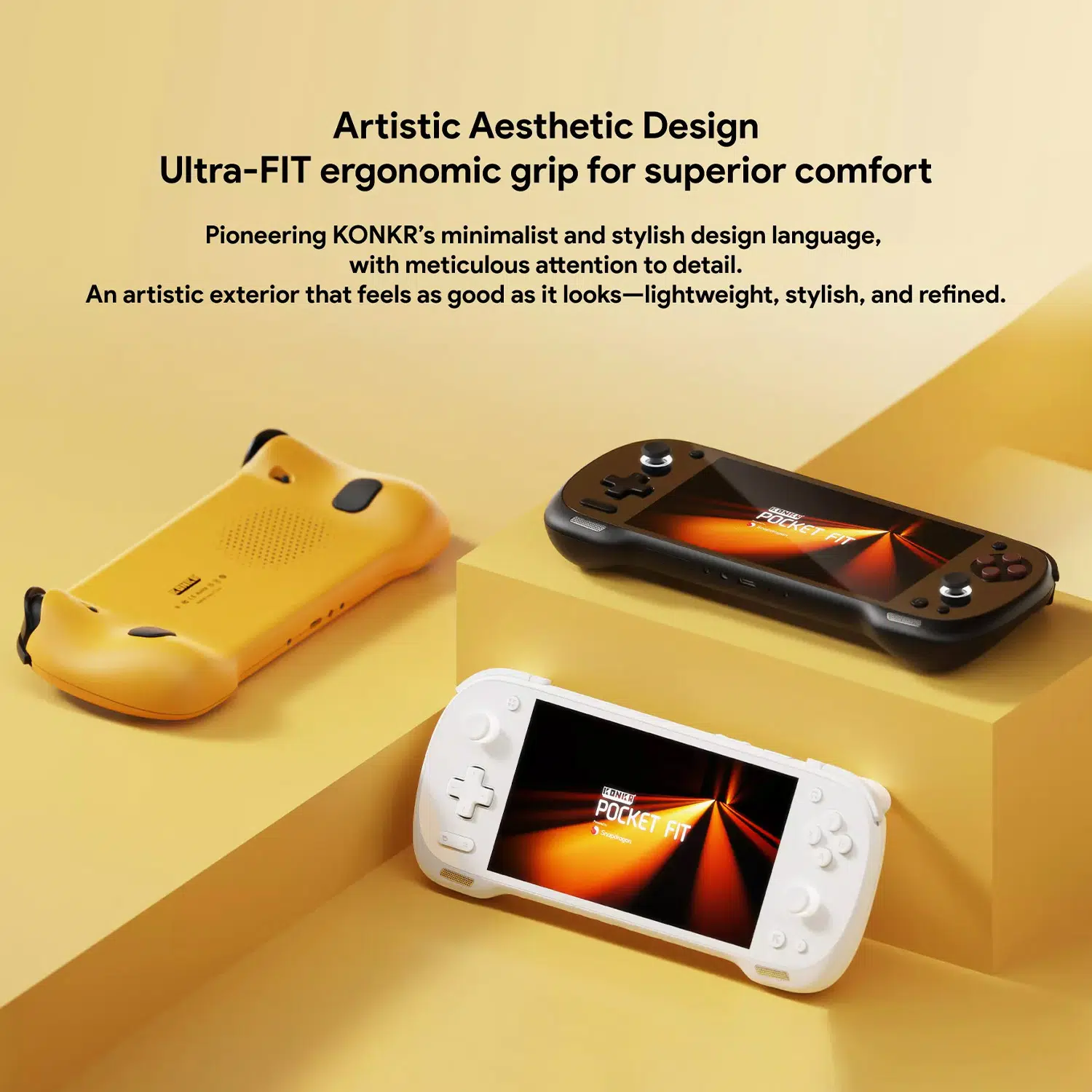 A promotional graphic for the KONKR Pocket Fit's design. The top of the image has the text "Artistic Aesthetic Design Ultra-FIT ergonomic grip for superior comfort." Below this, a yellow console is shown from the back, while black and white consoles are angled forward, showcasing their screens with a glowing orange abstract design. All three consoles are arranged on a light yellow and white geometric platform.