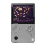 AYANEO-POCKET-DMG-SILVER-LISTING-DONE-01 - DROIX EU A front-on view of the AYANEO Pocket DMG handheld gaming console in a silver/grey color, set against a black background. The console has a vertical, Game Boy-inspired form factor with a large screen displaying a retro-style pixel art game featuring a cloud-like boss and orange projectiles. The controls include a prominent grey D-pad on the left, grey A, B, X, Y face buttons on the right, and a black analog stick positioned below the D-pad. The AYANEO POCKET DMG logo is visible below the screen.