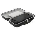 An angled, open view of the black carrying case. The interior is light grey, and a black GPD WIN 5 console is secured inside the bottom half with a white strap. A solid white protective screen cover/divider is over the device, and the top half of the case is empty. The case features an integrated carrying handle.