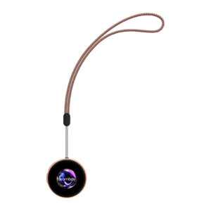 A front view of the NIKKO Badge TS device hanging from a brown braided lanyard/strap, isolated against a white background. The circular device is rose gold, and its black screen displays the white "beambox" logo over a swirling purple and blue abstract orb.