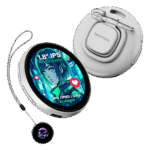 A white electronic badge with a round screen showing a blue, green, and red anime-style girl is shown. The screen displays text that reads "1.8” IPS TOUCHSCREEN" and "JPG / PNG / GIFS 3S videos" with small red heart icons to its side. A metal clip is attached to the back of the device. The device is hanging on a gray string attached to another smaller round device that is black with a glowing blue, purple, and green pattern in the center. The overall shape and color of the devices are reminiscent of round watches.