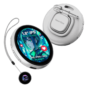 A white electronic badge with a round screen showing a blue, green, and red anime-style girl is shown. The screen displays text that reads "1.8” IPS TOUCHSCREEN" and "JPG / PNG / GIFS 3S videos" with small red heart icons to its side. A metal clip is attached to the back of the device. The device is hanging on a gray string attached to another smaller round device that is black with a glowing blue, purple, and green pattern in the center. The overall shape and color of the devices are reminiscent of round watches.