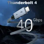 Stilizirana tržna slika z besedilom "Thunderbolt 4" na vrhu. Velik 3D kovinski logotip "40 Gb/s" se prepleta s pletenim kablom na ozadju temne gorske pokrajine. 
