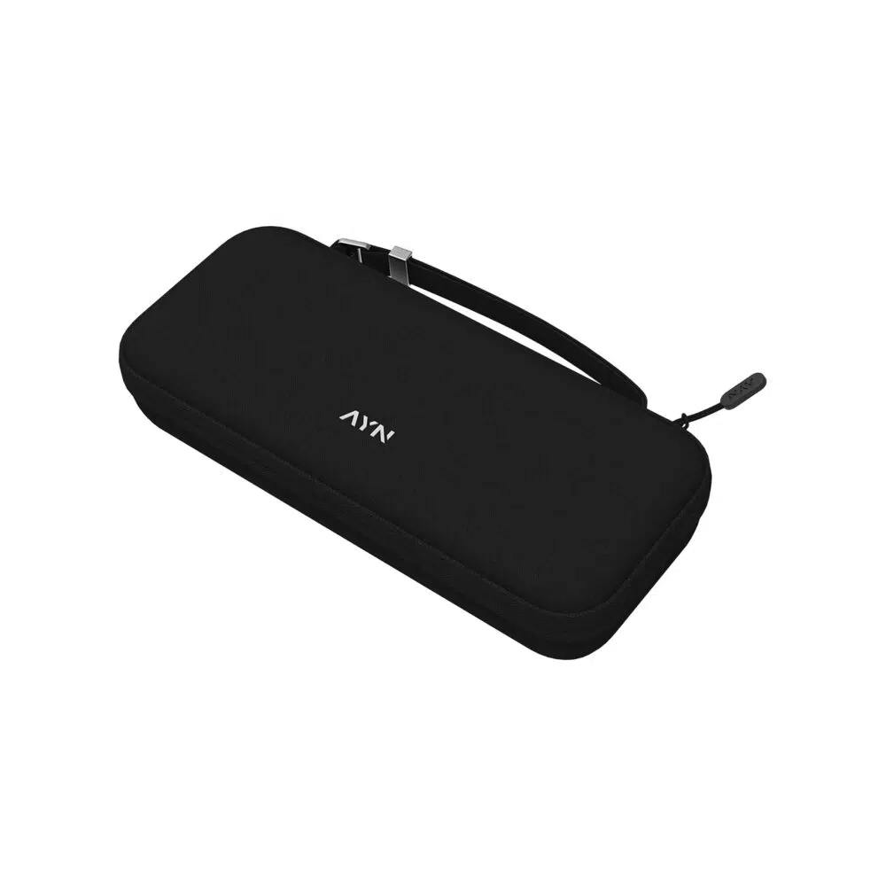 : An angled top-down view of a minimalist black hardshell case with a silver AYN logo in the center, a reinforced carrying strap, and a single zipper with an "AYN" branded pull tab.