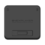 ONEXPLAYER-APEX-BATTERY-DOCK-LISTING-DONE-01 - DROIX EU A top-down view of the ONEXPLAYER APEX Battery Dock, a square-shaped, matte black electronic accessory with rounded corners. The center of the device features the embossed ONEXPLAYER logo, followed by the slogan "ENERGY ANCHOR, NATURALLY STRONG". There are two small rectangular indentations near the top corners and a larger, recessed rectangular port or connection area located at the bottom center of the face.
