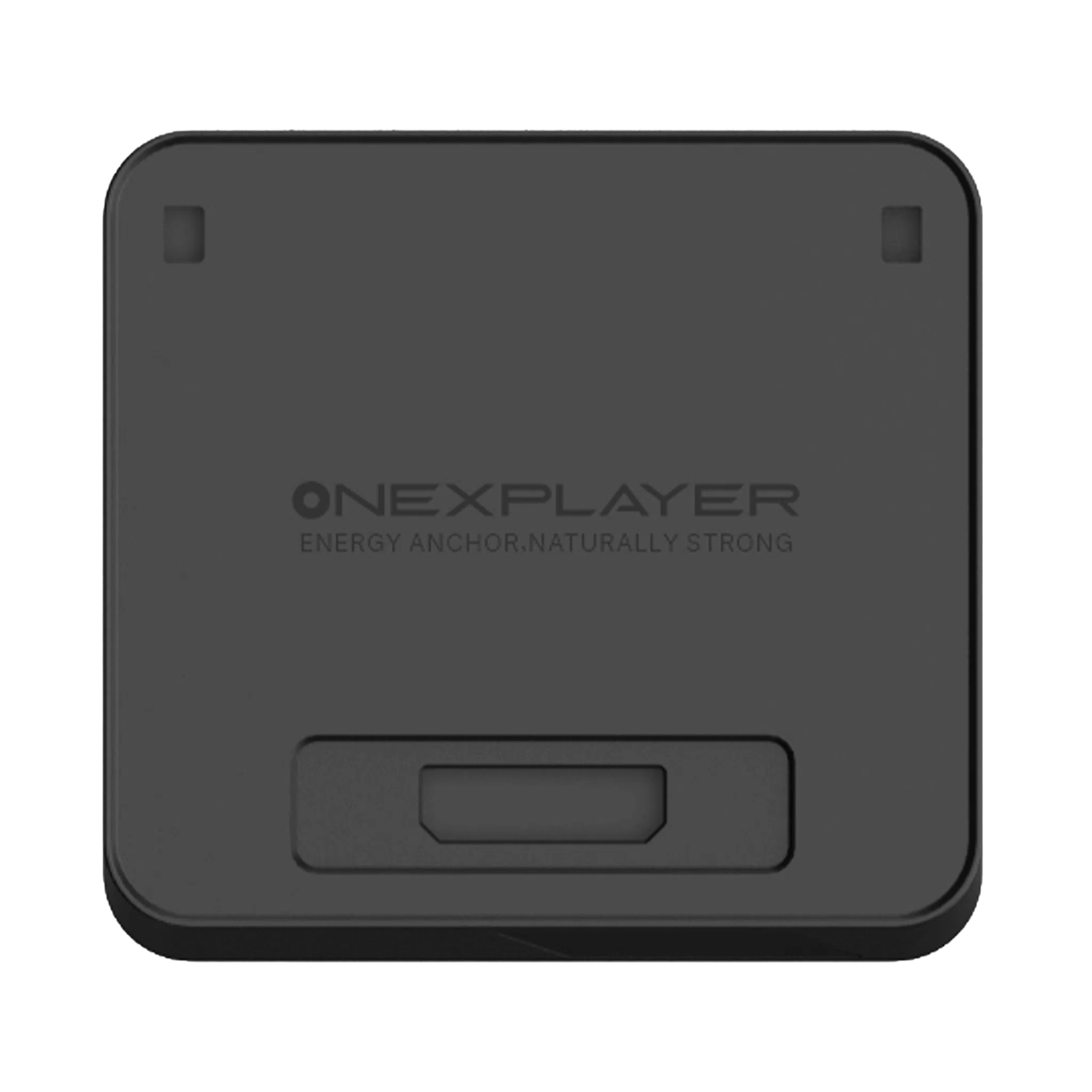 A top-down view of the ONEXPLAYER APEX Battery Dock, a square-shaped, matte black electronic accessory with rounded corners. The center of the device features the embossed ONEXPLAYER logo, followed by the slogan "ENERGY ANCHOR, NATURALLY STRONG". There are two small rectangular indentations near the top corners and a larger, recessed rectangular port or connection area located at the bottom center of the face.