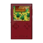 A front-facing view of the AYANEO Pocket DMG in a deep metallic red. The vertical device shows a bright screen with gameplay from Stardew Valley. The D-pad and action buttons are finished in the same red color as the body, giving it a uniform, premium look.