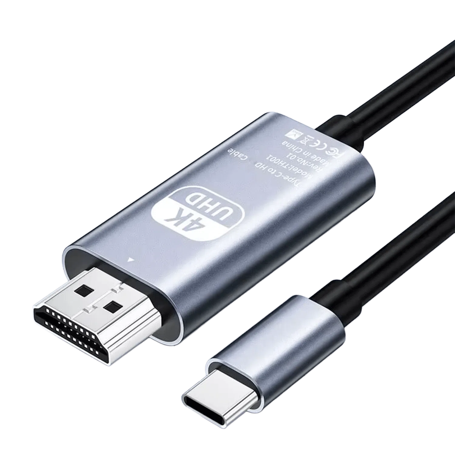 A studio photograph displays a metallic silver colored Type-C to HD adapter cable against a black background. The main body of the adapter features text in English: “4K UHD Type-C to HD Cable Model TH001 Rev: No.01 Made in China” alongside CE, WEEE, and FCC symbols. Connected to this metallic body are an HDMI male connector on one end and a black insulated cable on the opposite end. Additionally, a separate Type-C male connector, with its matching silver housing, is shown below the main body, also with its cable partially visible. All connections feature black heat shrink or plastic where the cables meet the connectors.