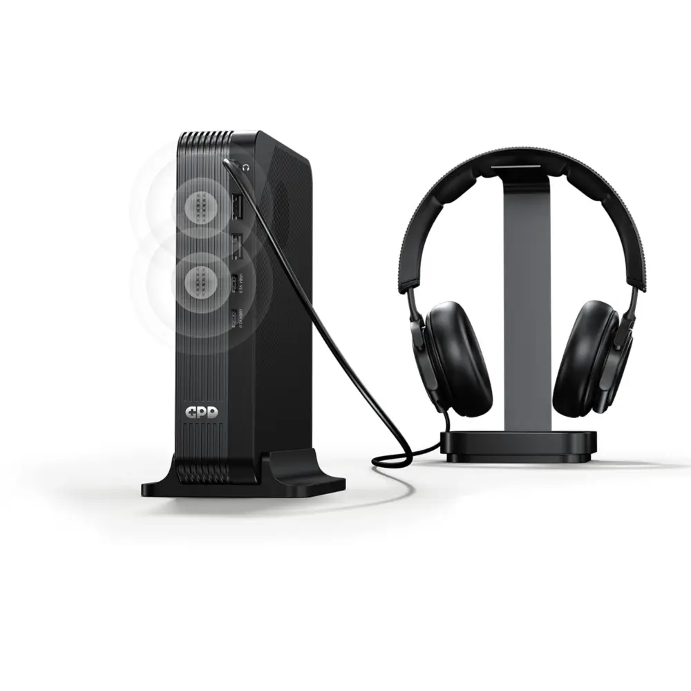 GPD BOX black ribbed GPD Mini PC front angled view with USB ports, antenna, and headphones on stand