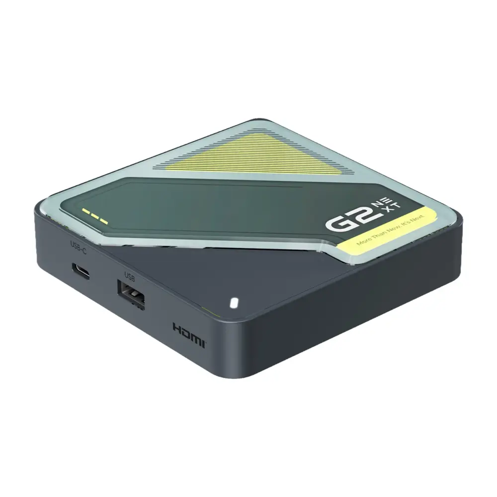Angled RockTek G2 Next Google TV box, matte dark gray with translucent top, yellow striped panel, USB-C and HDMI ports